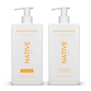 Two white Native hair product bottles, shampoo and conditioner, almond and shea butter