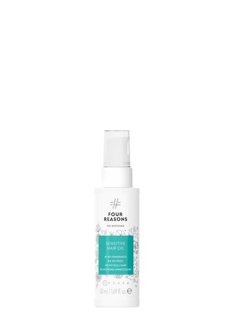 White bottle of "Four Reasons" sensitive hair oil with spray top