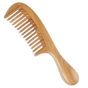 Wooden wide-tooth comb with a handle, isolated on a white background