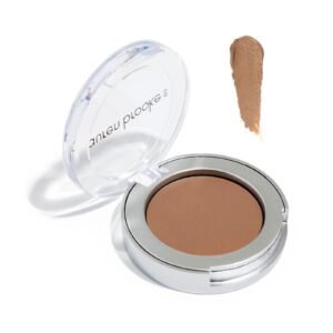 Open compact of brown makeup with a swatch of the product