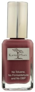 Bottle of Karma Hues nail polish, mauve color, silver cap, label details