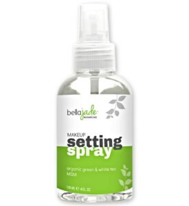 Makeup setting spray bottle with green and white label, botanical design