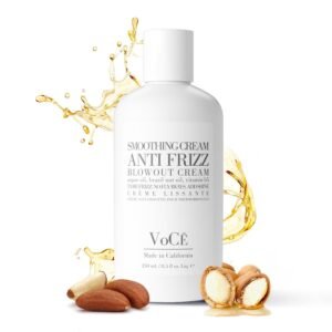 White bottle of anti-frizz smoothing cream with oil splash and nuts