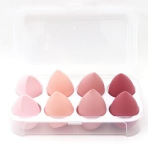Eight pink and red teardrop-shaped makeup sponges in a clear plastic case