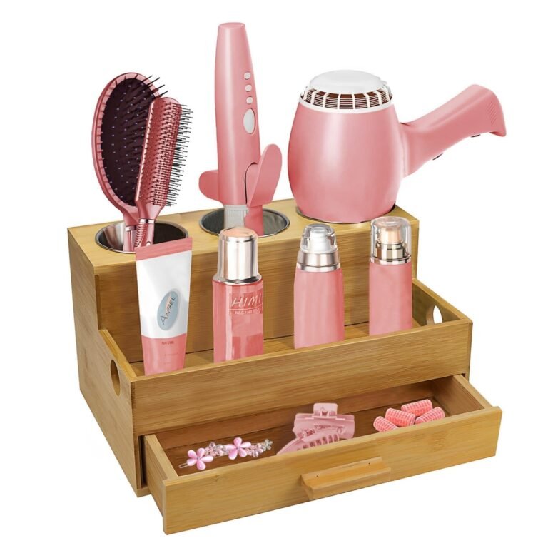 Pink hair styling tools and accessories in a bamboo organizer