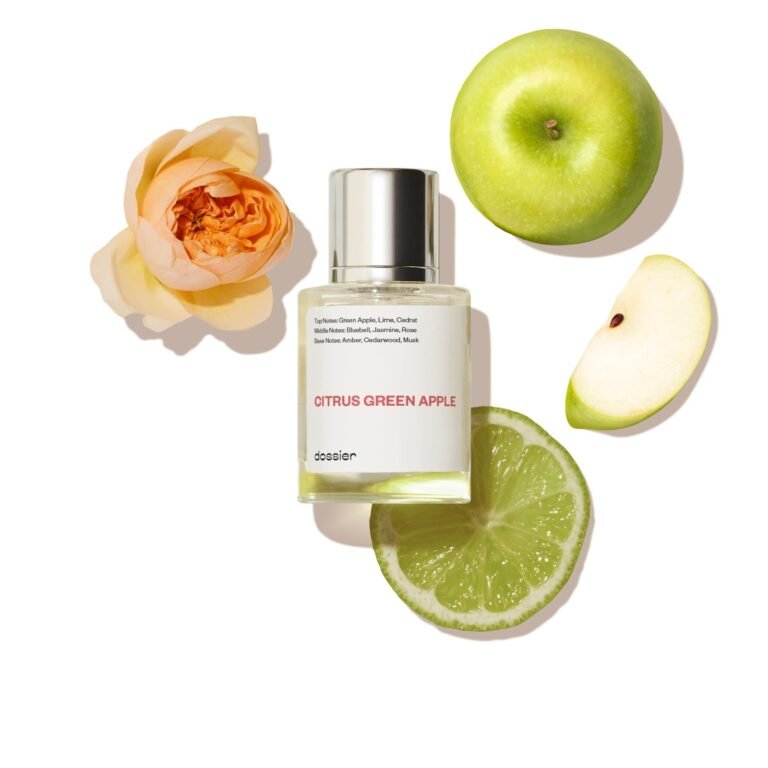 Perfume bottle with green apple, lime, and flower on white background