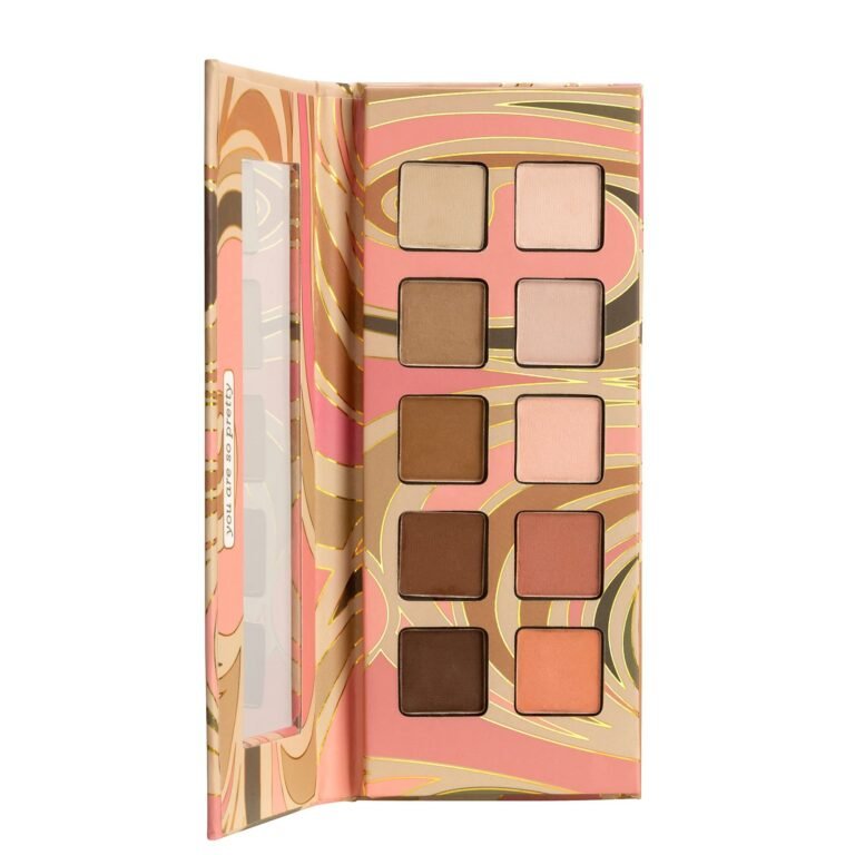 Open eyeshadow palette with ten neutral shades and a decorative cover