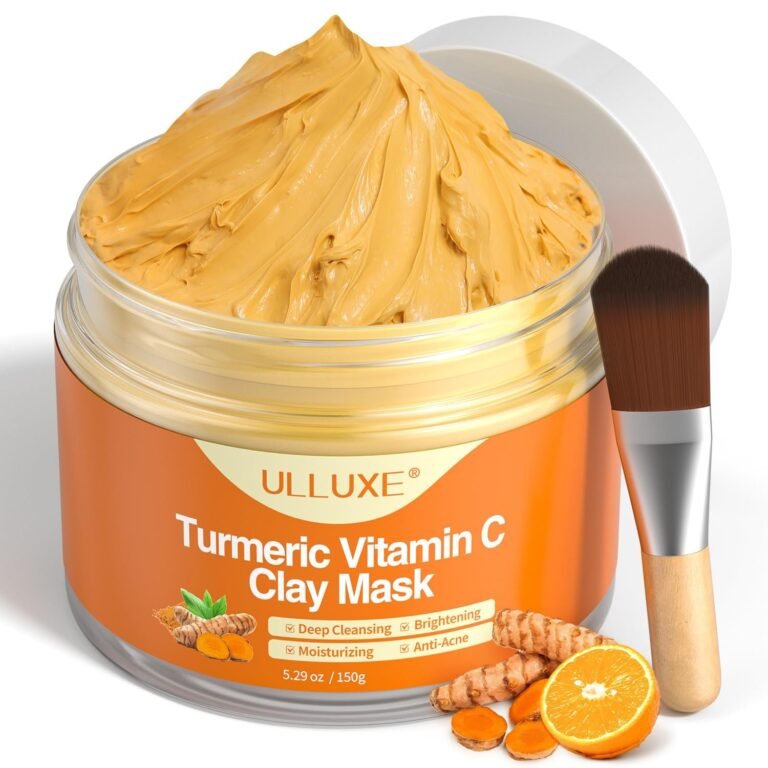 Jar of turmeric vitamin C clay mask with brush and ingredients
